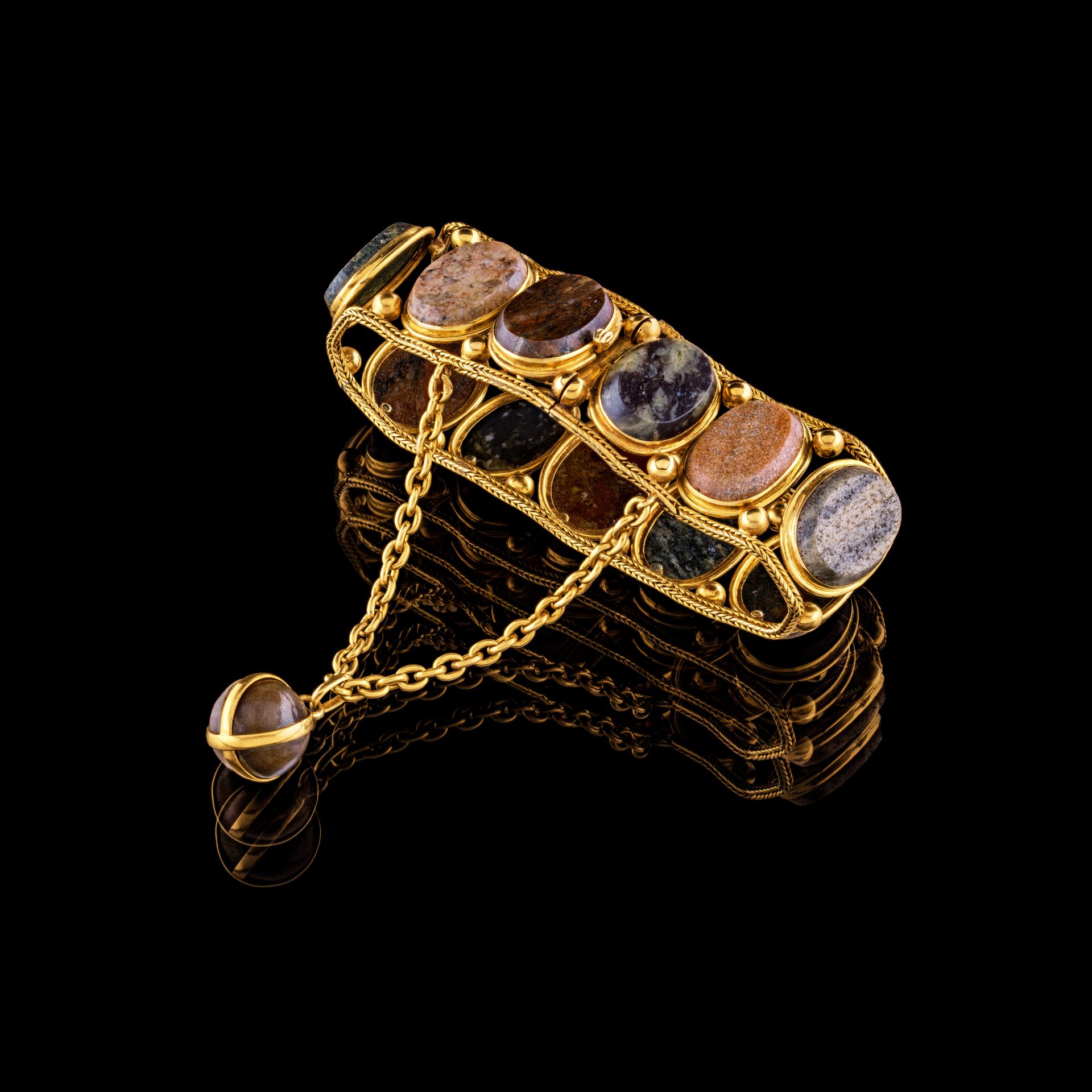 A piece of jewelry with gold details.