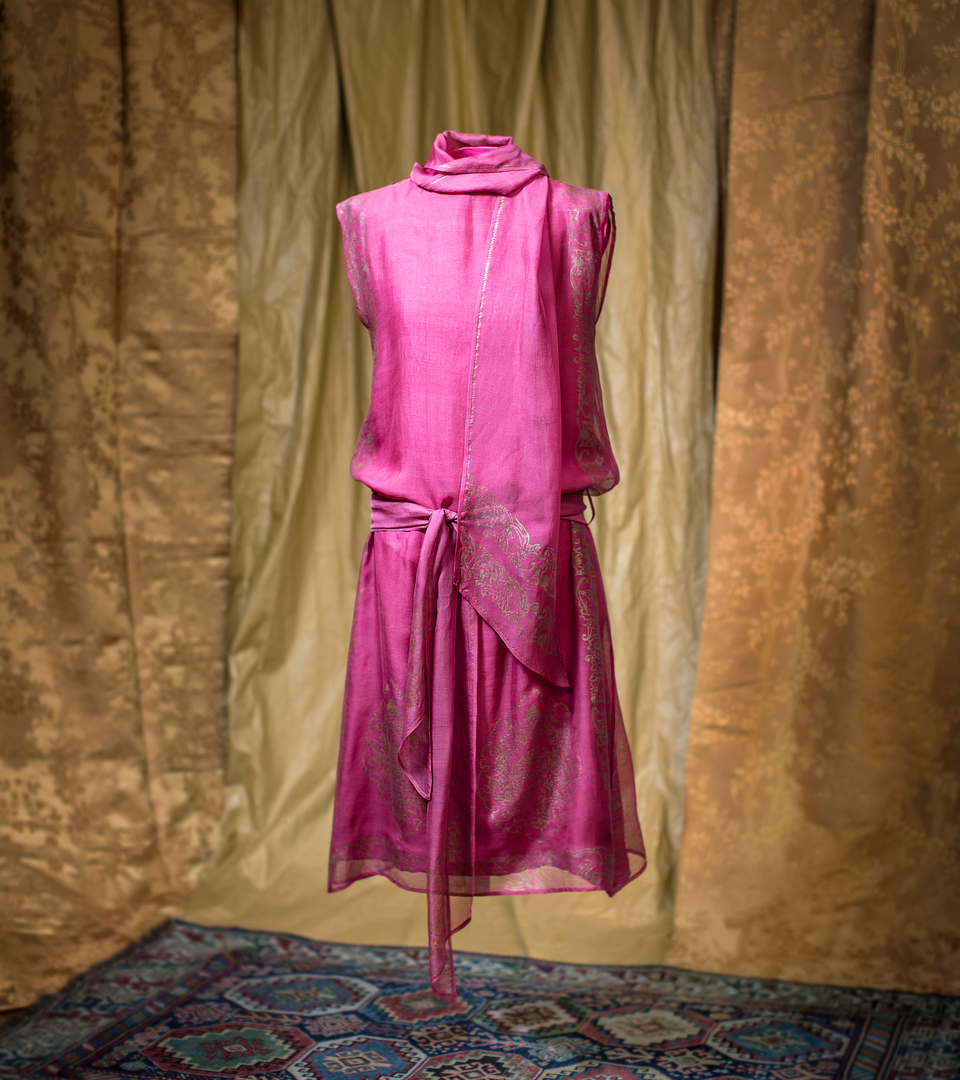 Dress by Mariano Fortuny in cerise with yellow print