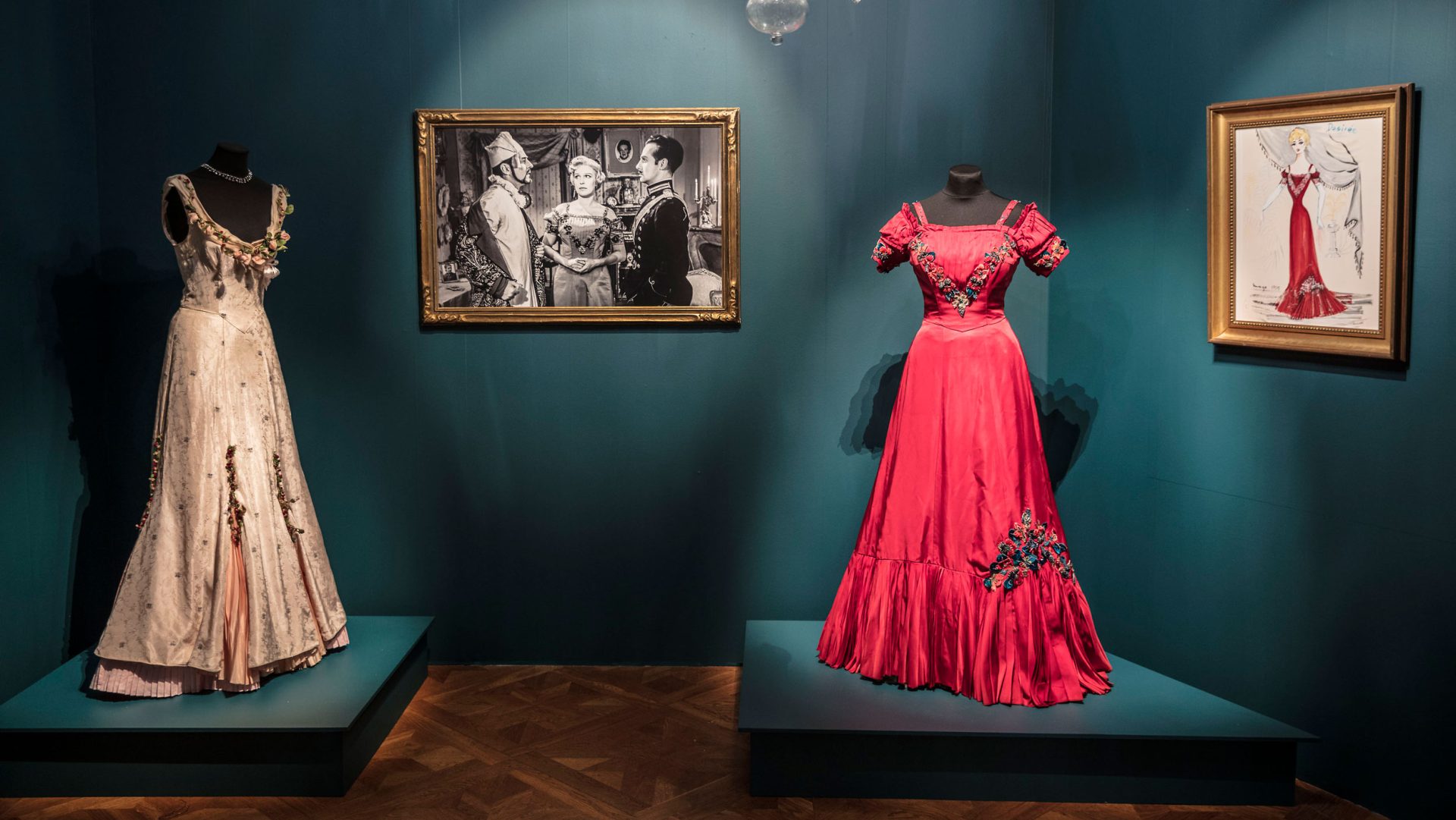 Two dresses from films by Bergman are shown together with a photo and sketch of the same dresses.