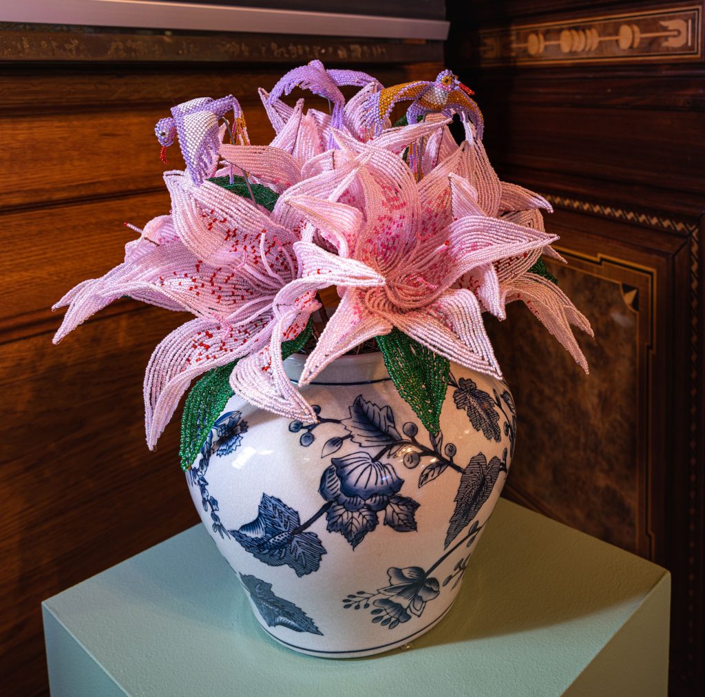 Pink flowers in a patterned pot.