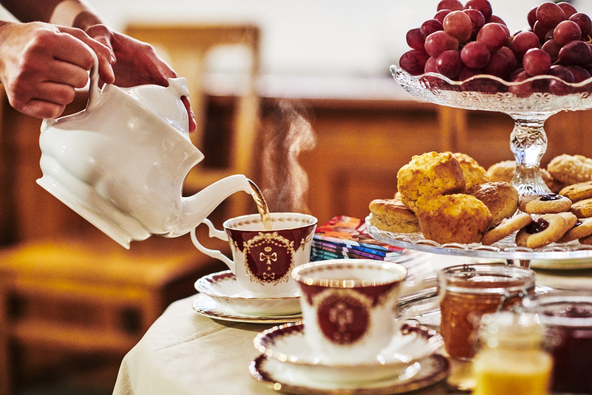 A table set with scones and tea. 