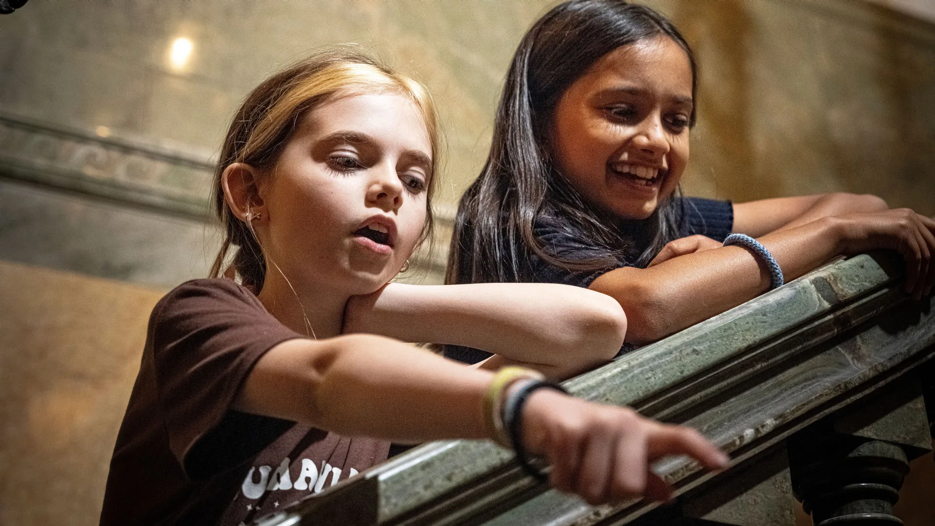 Children pointing and looking together